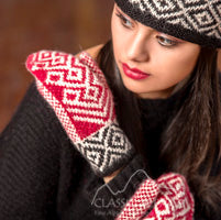 Woman wearing Norwegian patterned mittens with a blurred background