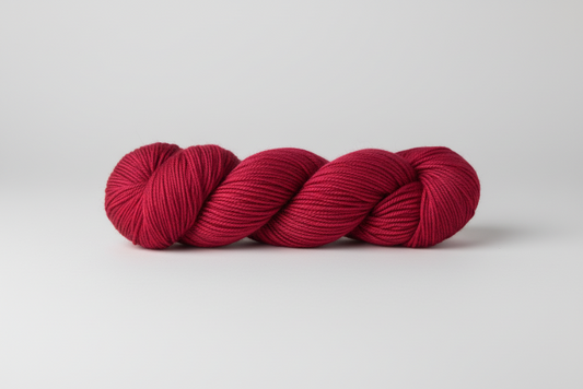 Cherry Red skein of yarn on a white background