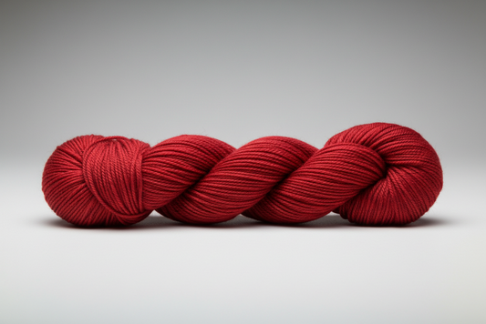 Warm Red skein of yarn on a white background
