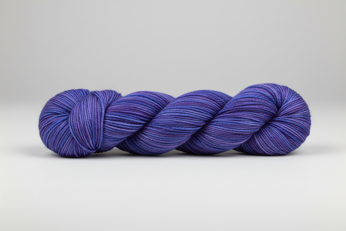 Variegated Blue skein of yarn on a white background