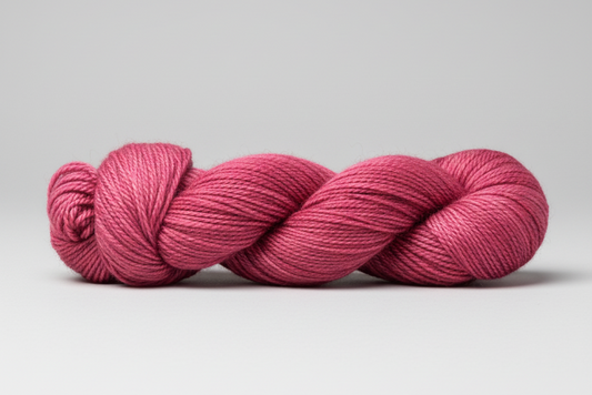 warm pink yarn on a light gray background