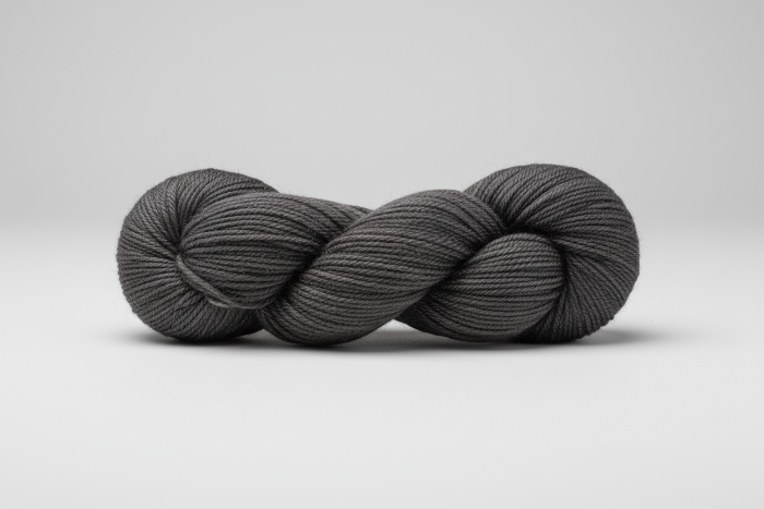 Steel Grey skein of yarn on a white background